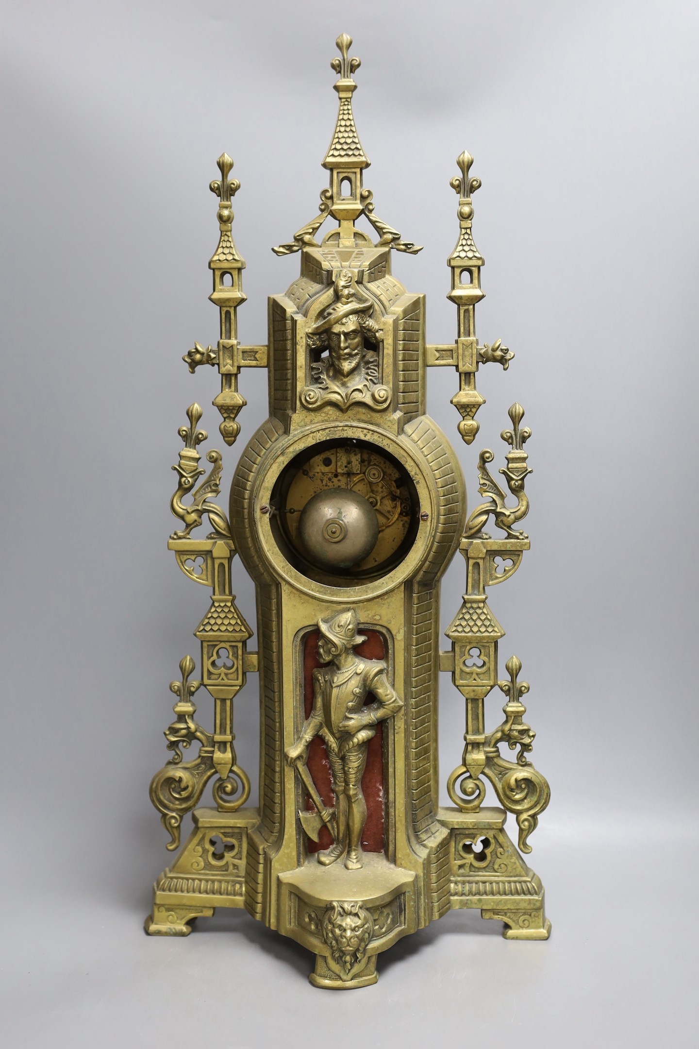 An ornamental gilt brass clock with French bell striking movement - 59cm tall